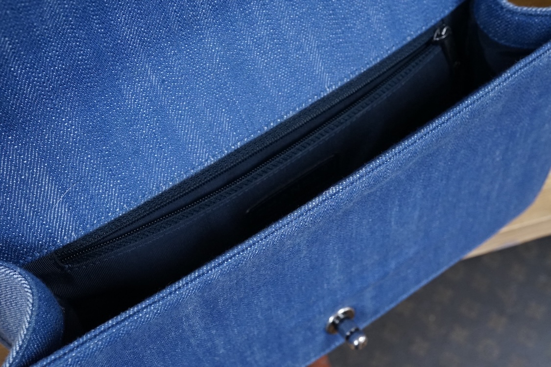 A Chanel denim cheveron flap shoulder bag with silver hardware, date code 20845697, 28cm wide
